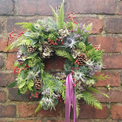 Designer's Choice Wreath - Our designers choice Christmas wreaths are hand made on a mossed frame with a beautiful, seasonal selection of foliage, berries and dried flowers. Perfect to decorate your door.